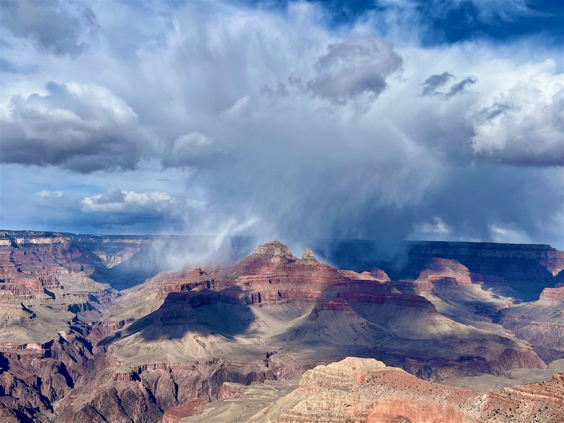 A desert monsoon storm sweeping over the Grand Canyon South Rim
