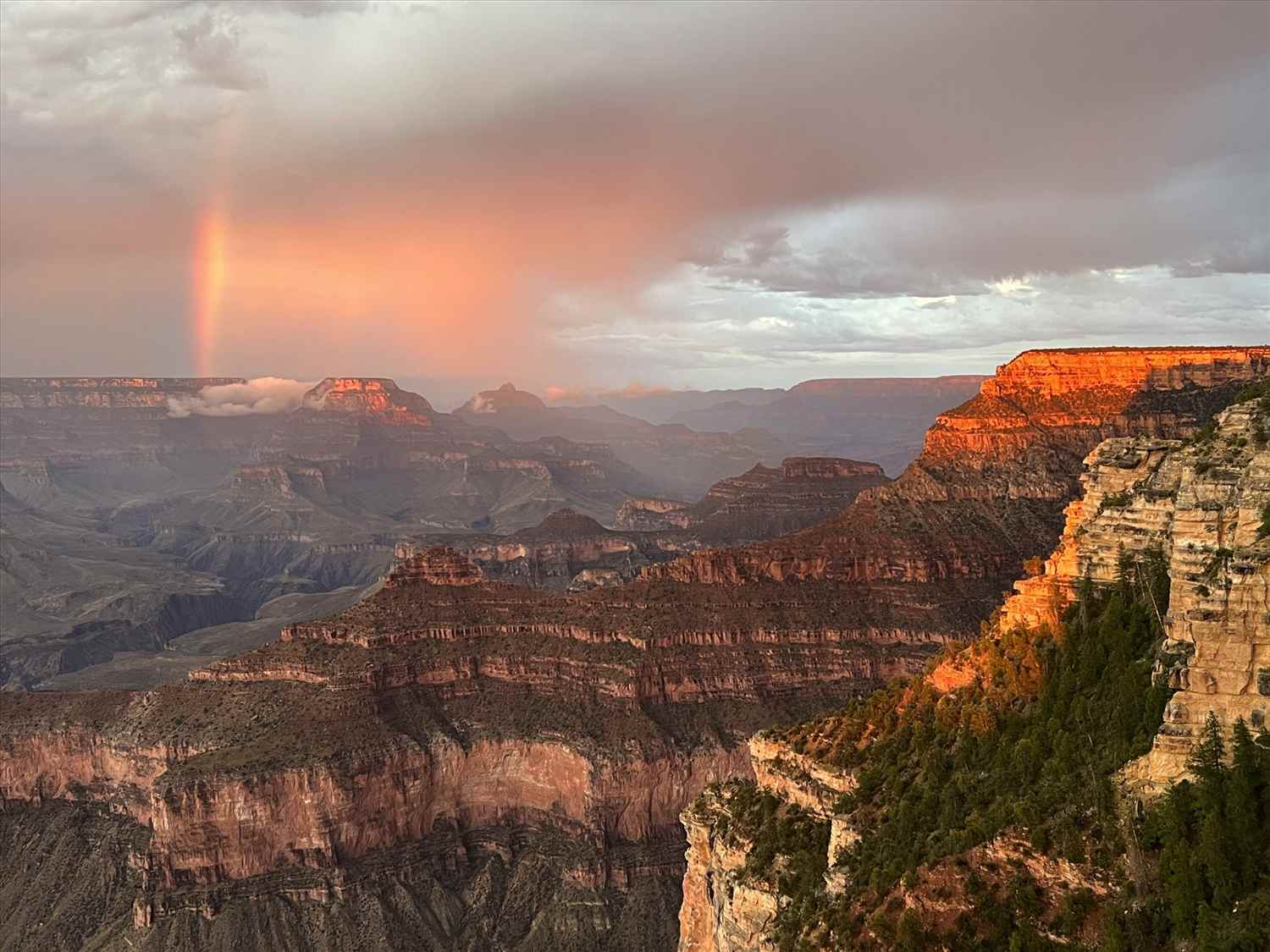 A rainbow over the Grand Canyon South Rim at sunset