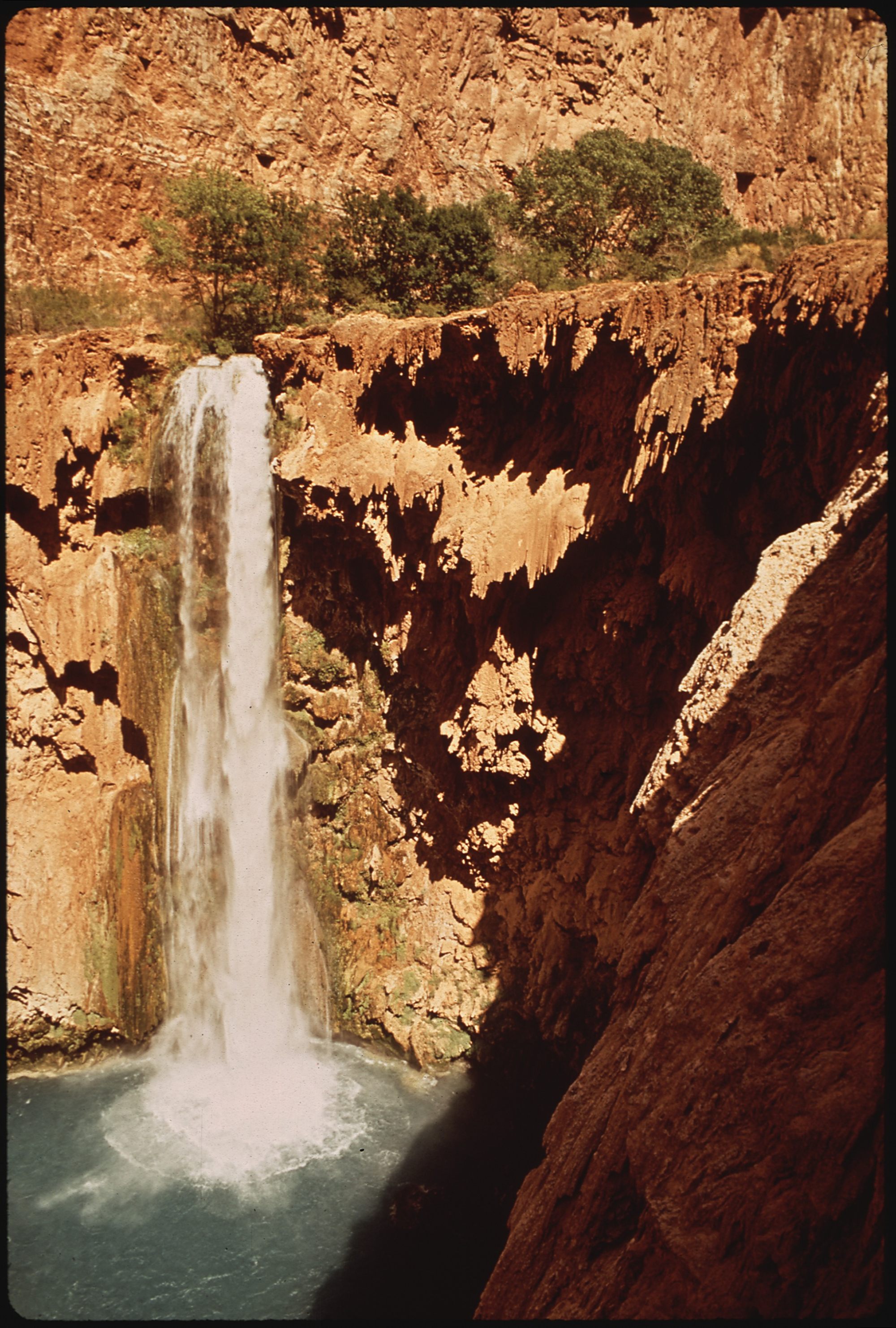 Havasu Falls' blue-green waterfall in the Grand Canyon, homeland of the Havasupai Tribe (U.S. National Archives, EPA DOCUMERICA Project)